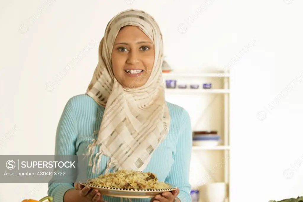 Arab Lady holding plate of rice