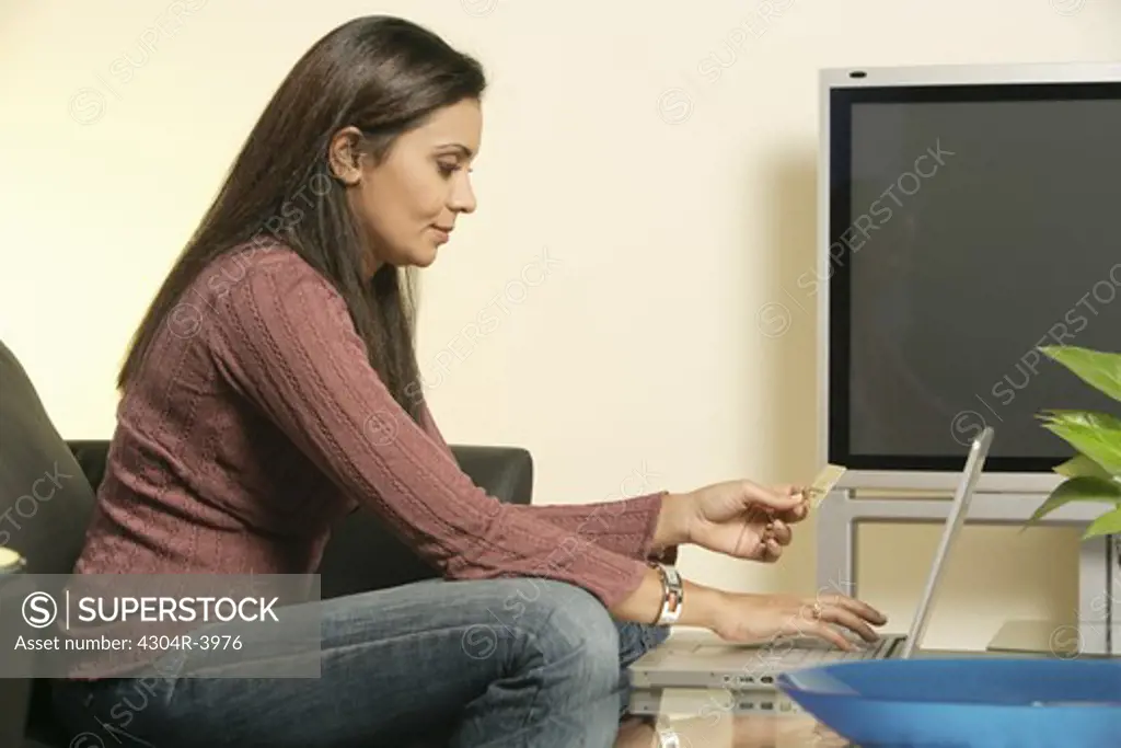 Lady busy in online transaction