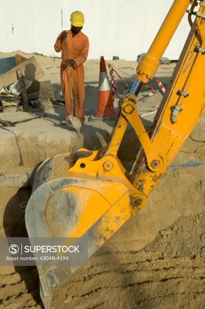 View of a machine digging the sand
