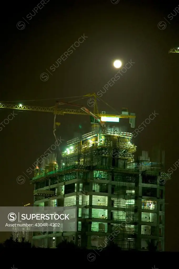 Illuminated view of the construction building seen during at night
