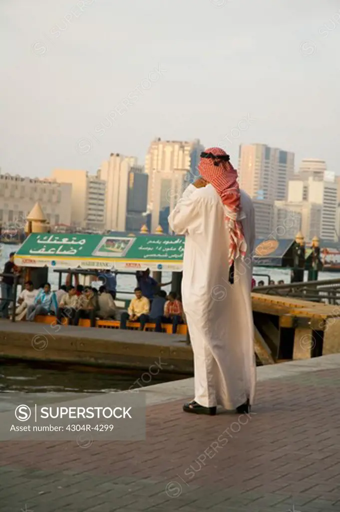 Arab Man waiting for the boat