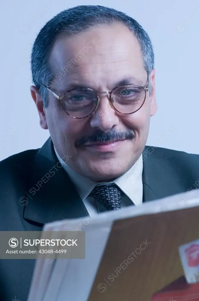 Businessman reading the newspaper