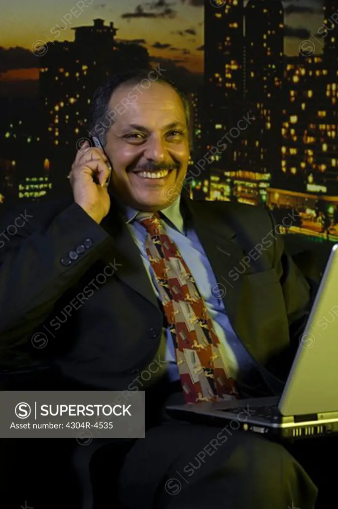 Senior Executive working on his laptop computer