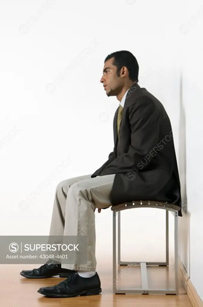 Young man sitting waiting