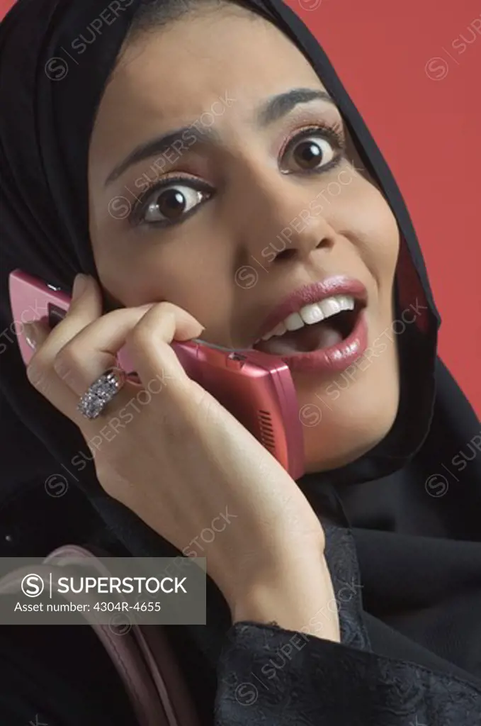 Arab Lady talking on cell phone