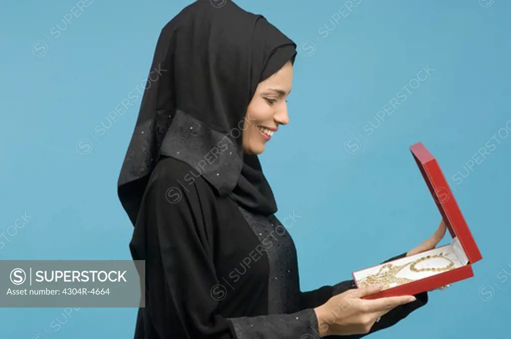 Arab Lady looking at jewelry
