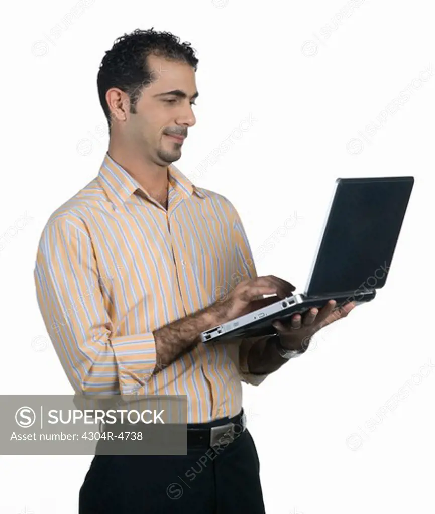 Man holding a laptop computer