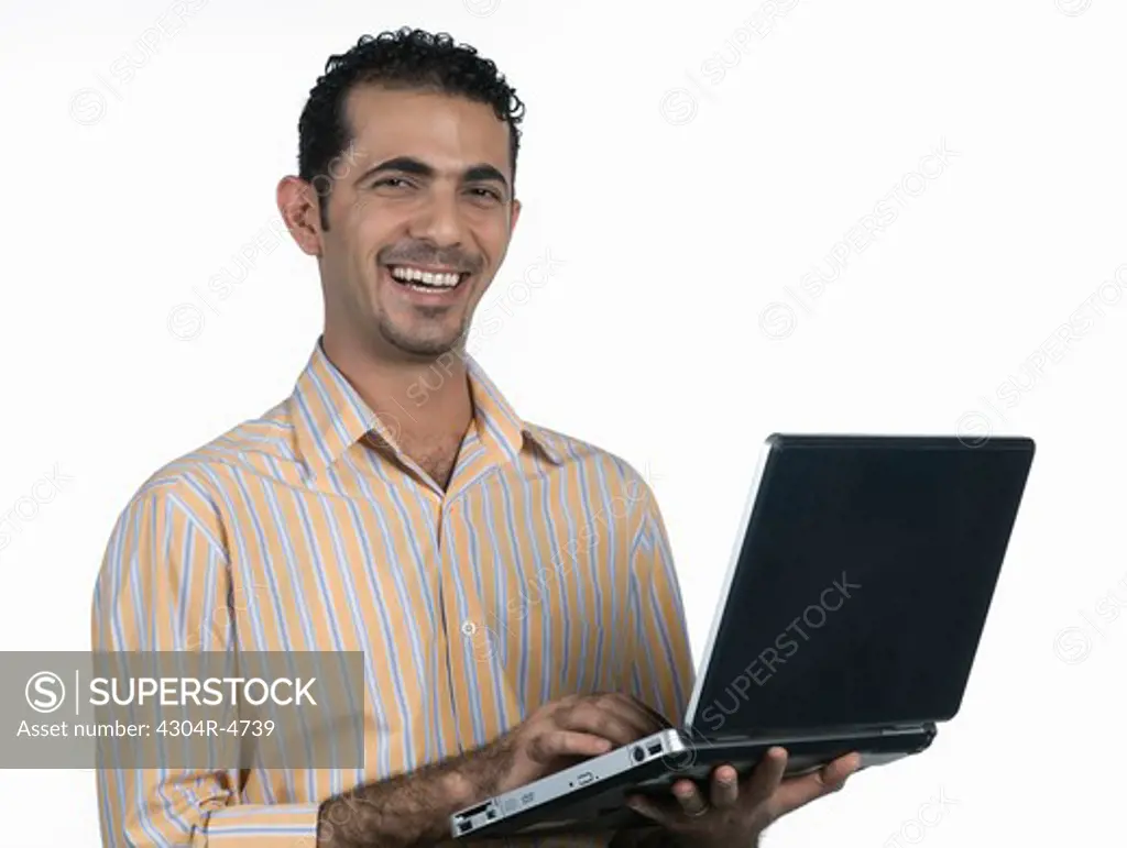 Man holding a laptop computer