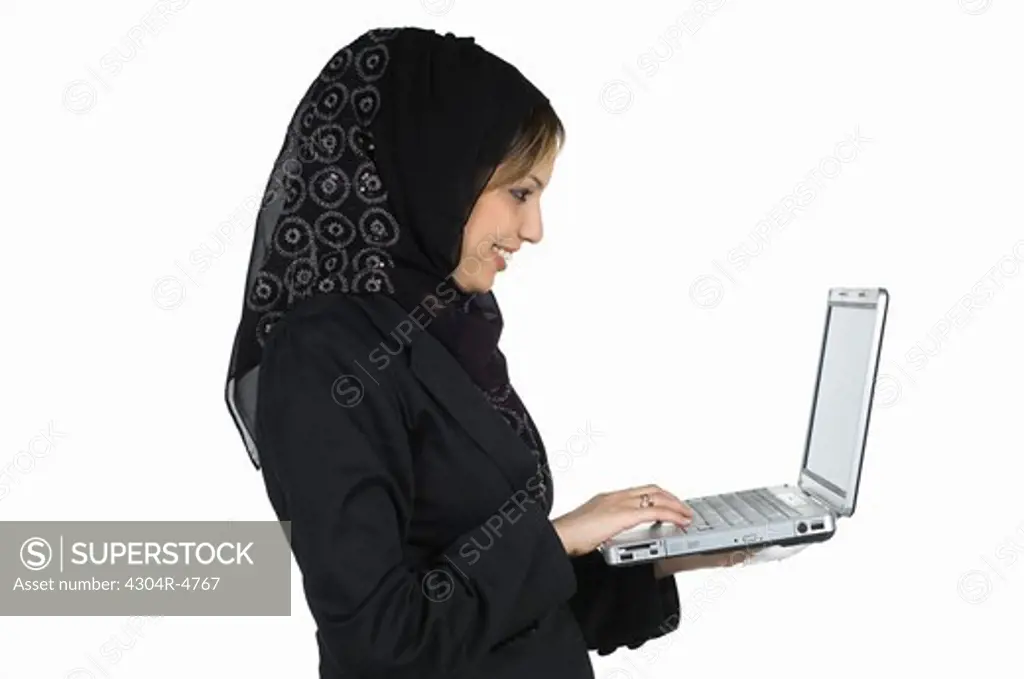 woman holding a laptop computer