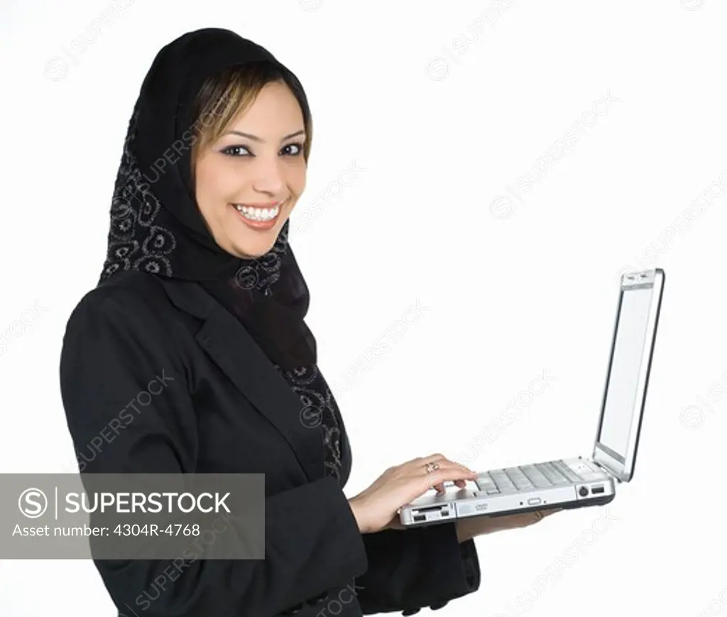 Woman holding a laptop computer