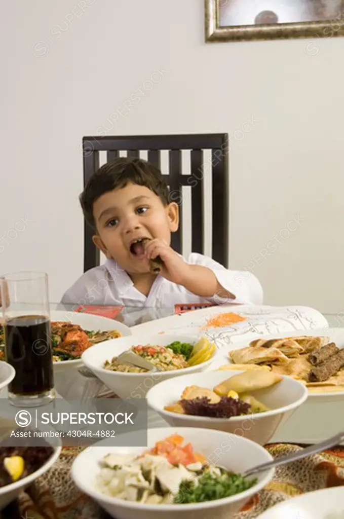 Young Boy eating at the dining table