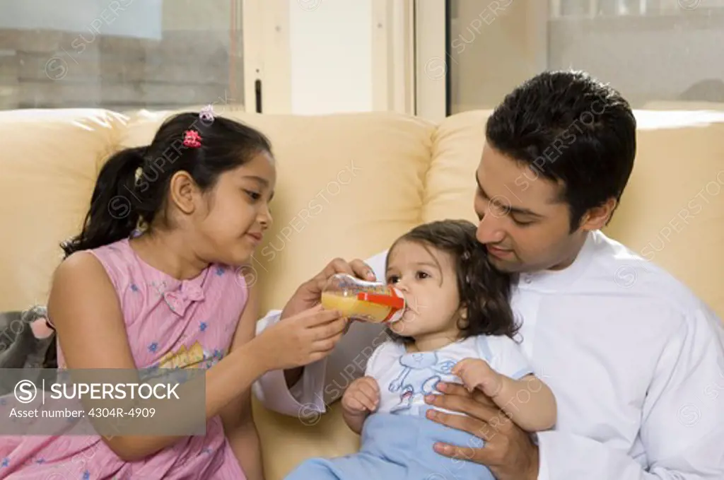 Father with children in the living room