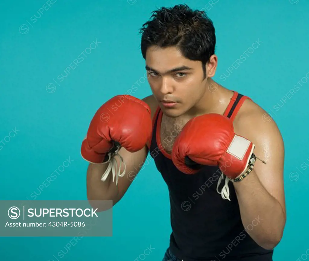 Teenager with boxing gloves
