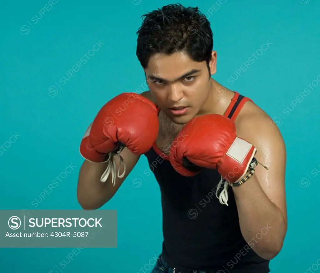 Teenager with boxing gloves