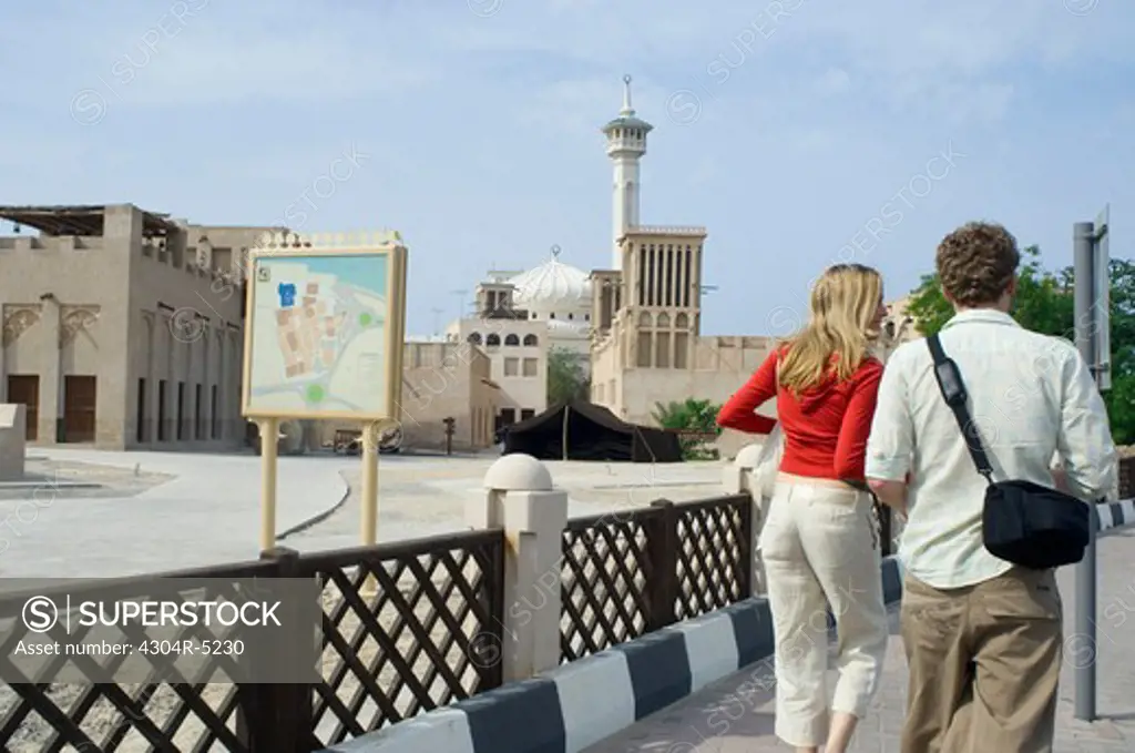 Couple visiting historical site, Dubai, United Arab Emirates