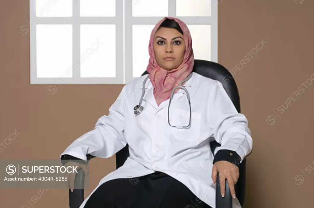 Female doctor wearing stethoscope, portrait