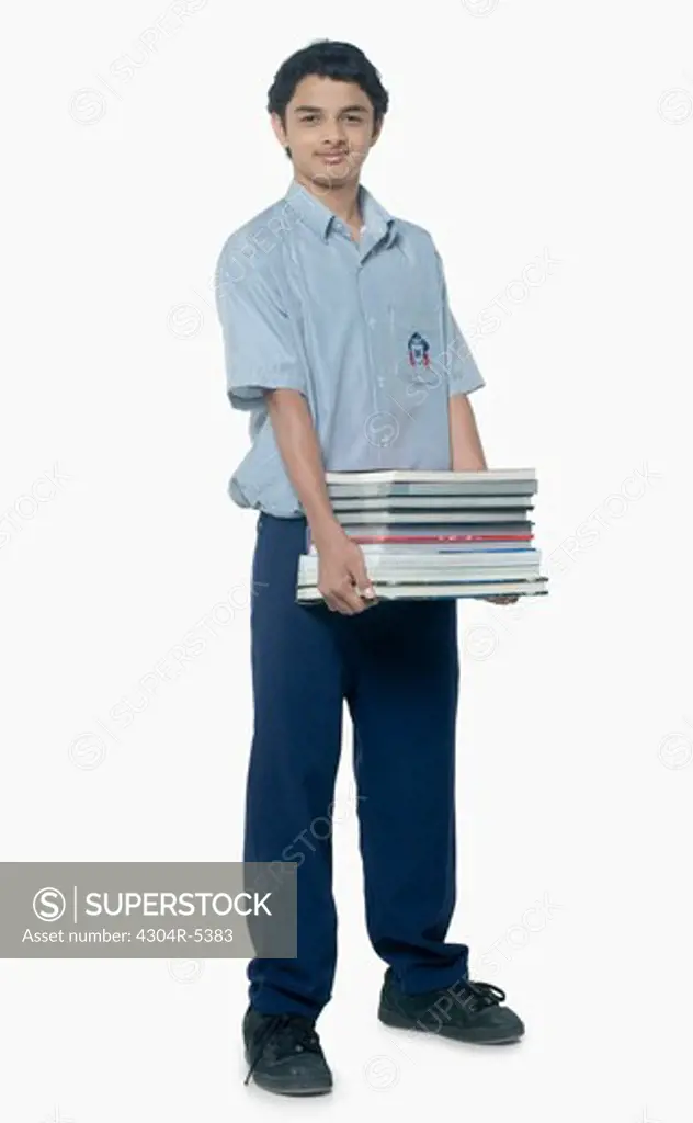 Teenage boy carrying books