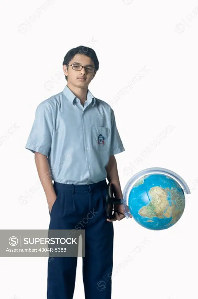 Teenage boy holding globe