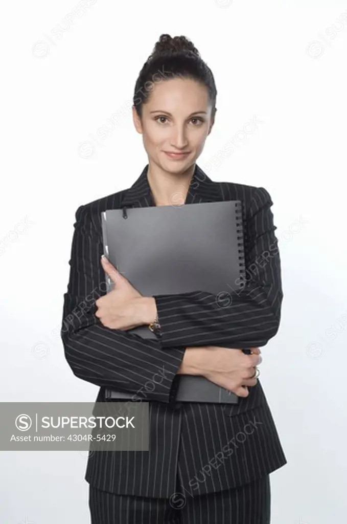 Young woman holding file, portrait