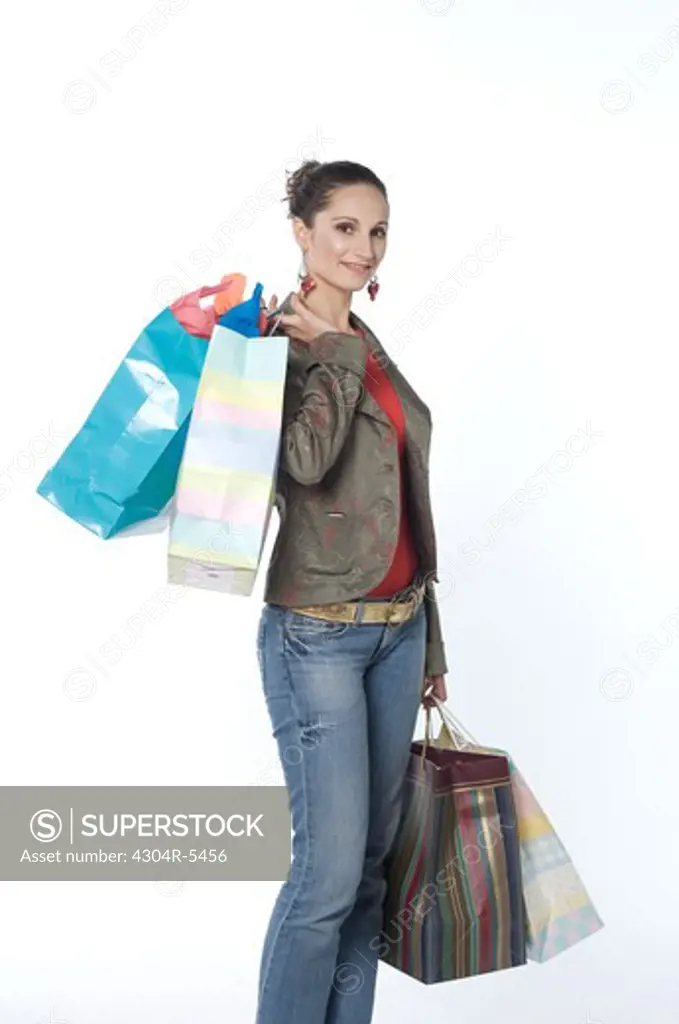 Woman carrying shopping bag, portrait