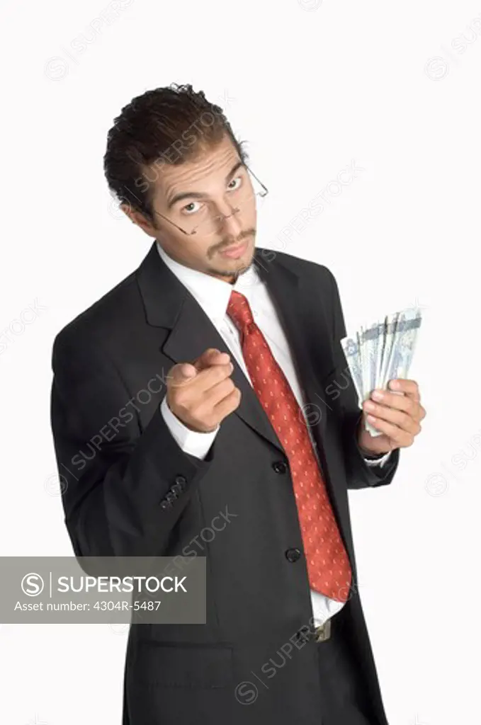 Businessman holding money, portrait