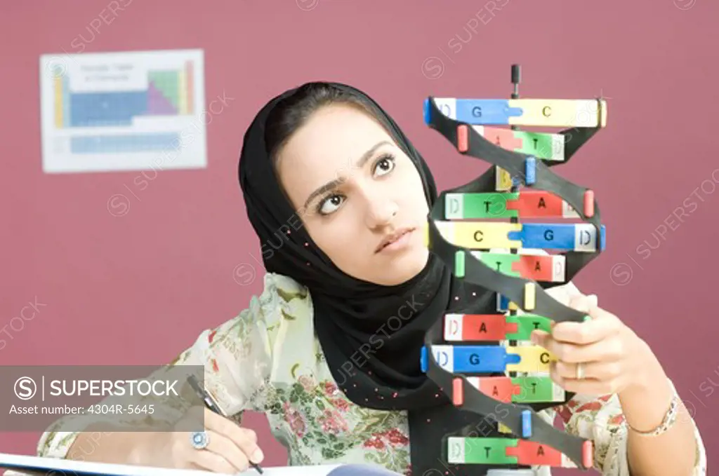Woman looking at helix model