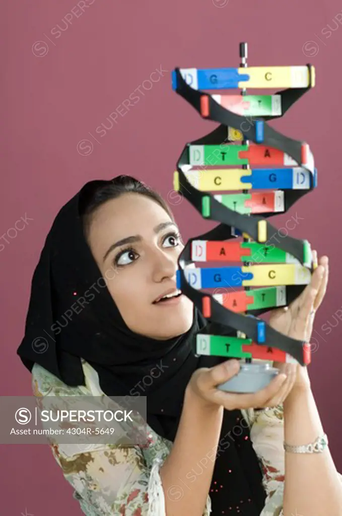 Woman holding helix model