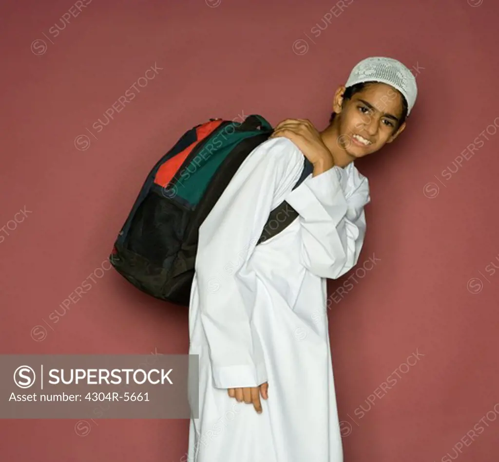 Boy (10-11) carrying shoulder bag