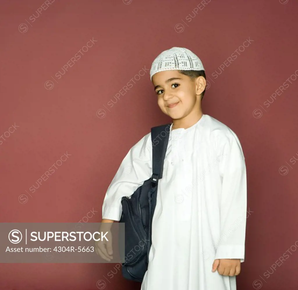 Boy (8-9) carrying shoulder bag, portrait, smiling