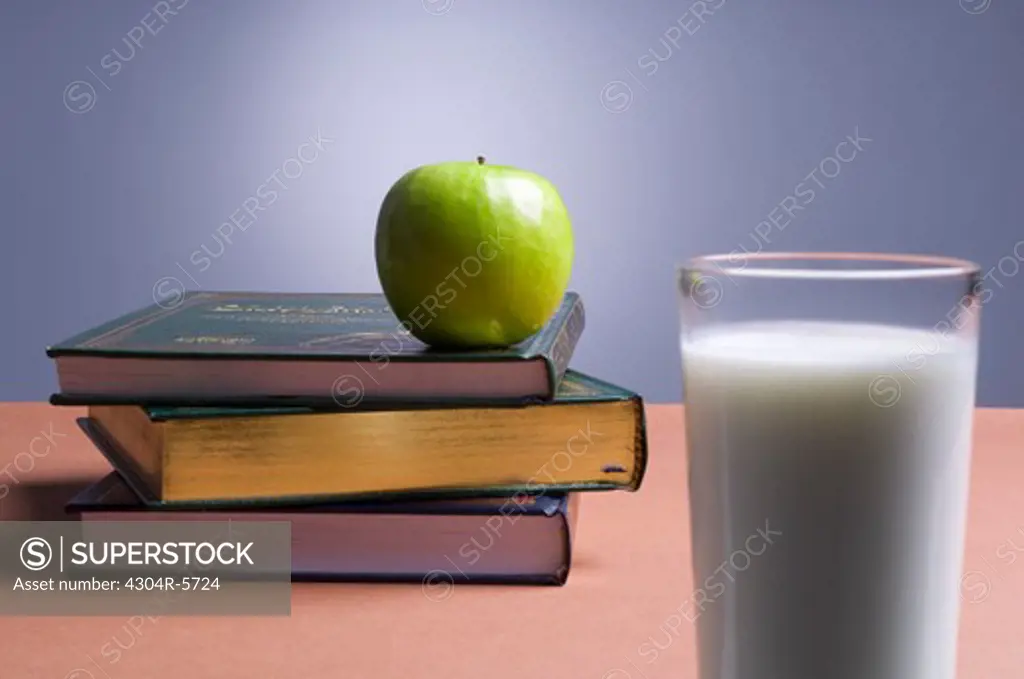 Apple on top of books,close-up