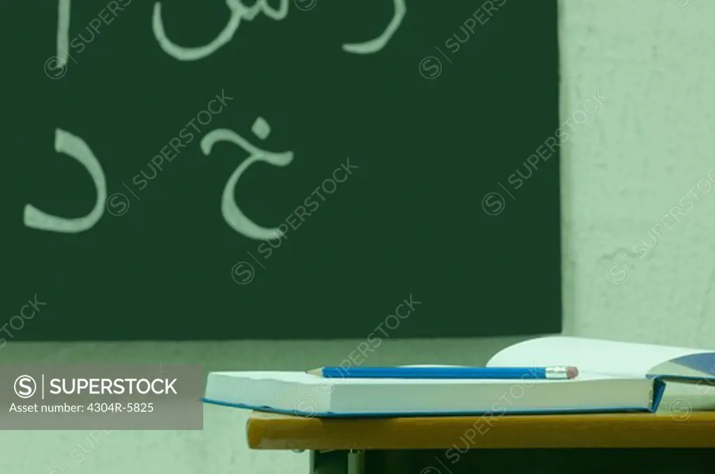 Script written on board in classroom