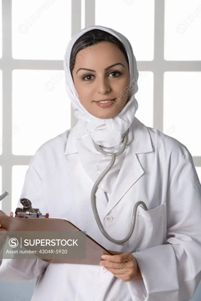 Young doctor with stethoscope, portrait, close-up