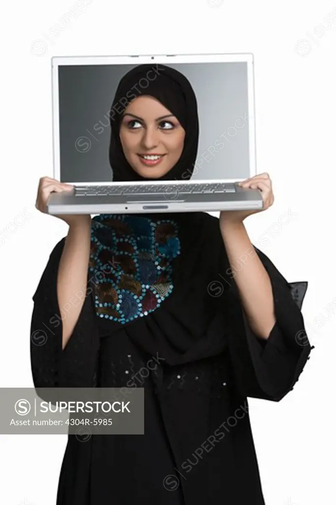 Young woman holding laptop