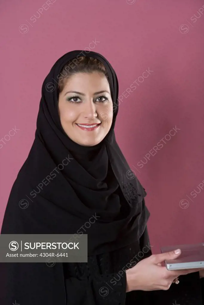 Young woman with laptop, portrait
