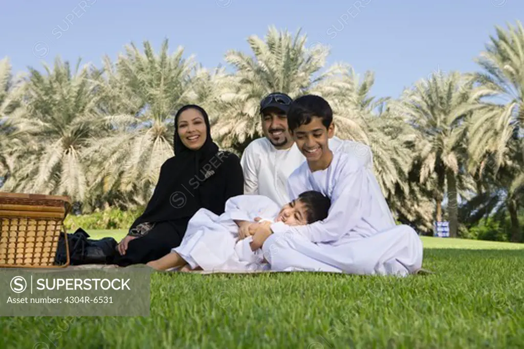 family enjoying at park, smiling