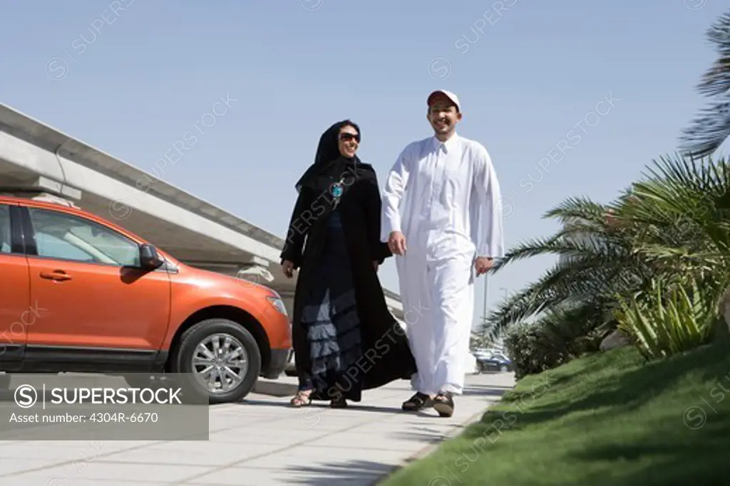 Young couple walking on road