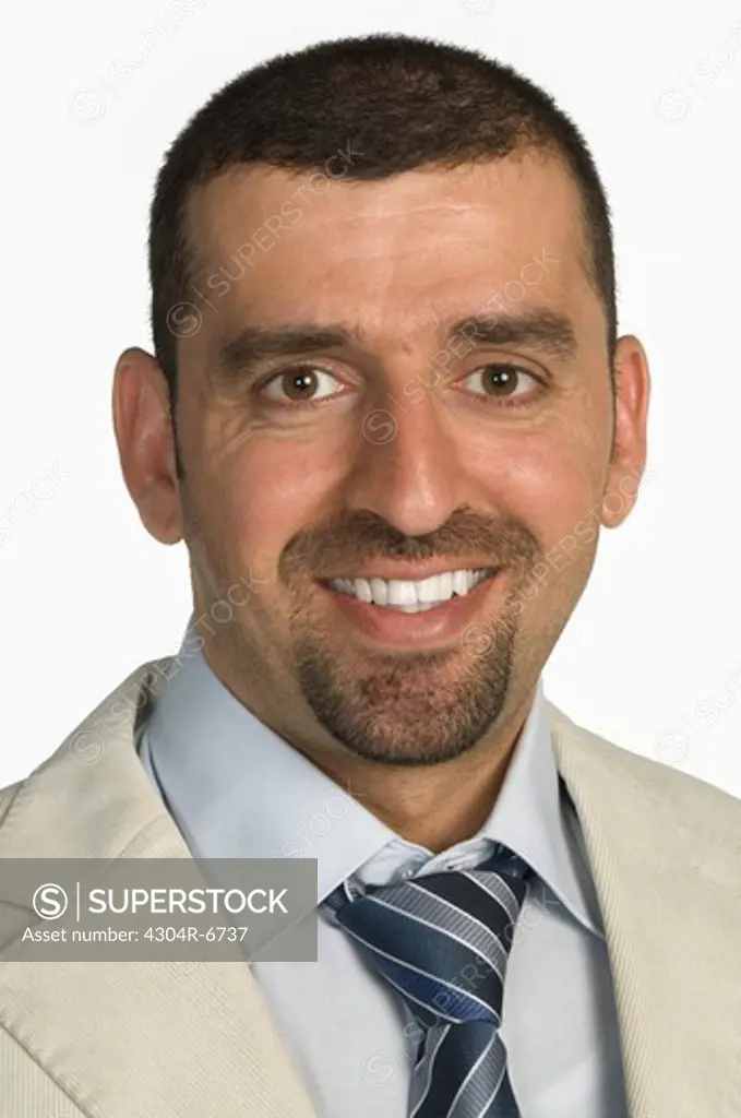 Businessman smiling, close-up