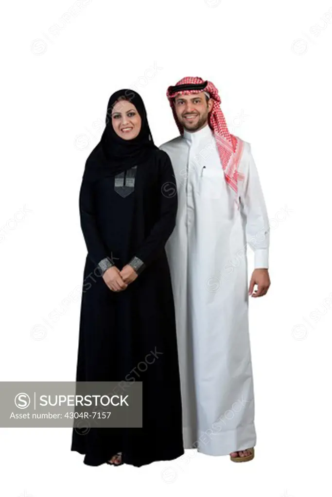 Arab couple wearing traditional dress, smiling