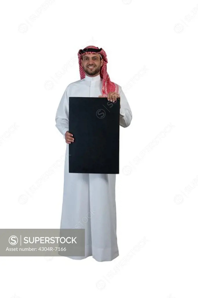 Arab man holding a placard