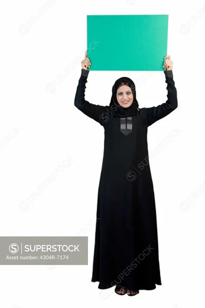Arab woman holding a placard