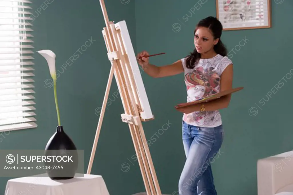 Young woman painting