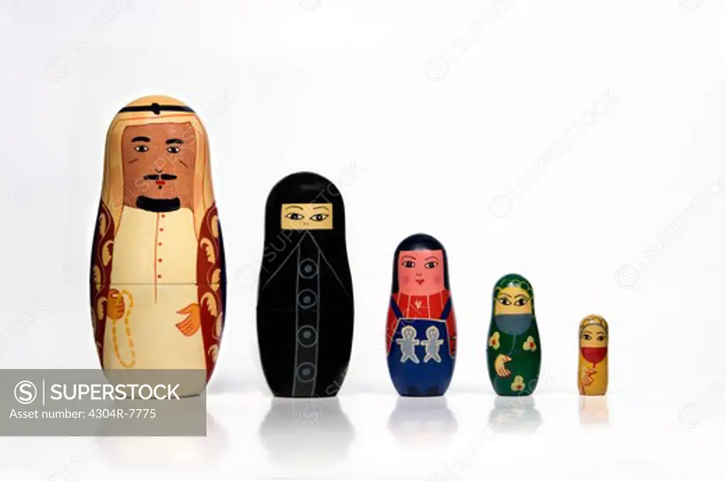 Set of Arabian matryoshka dolls arranged in a row by order of size