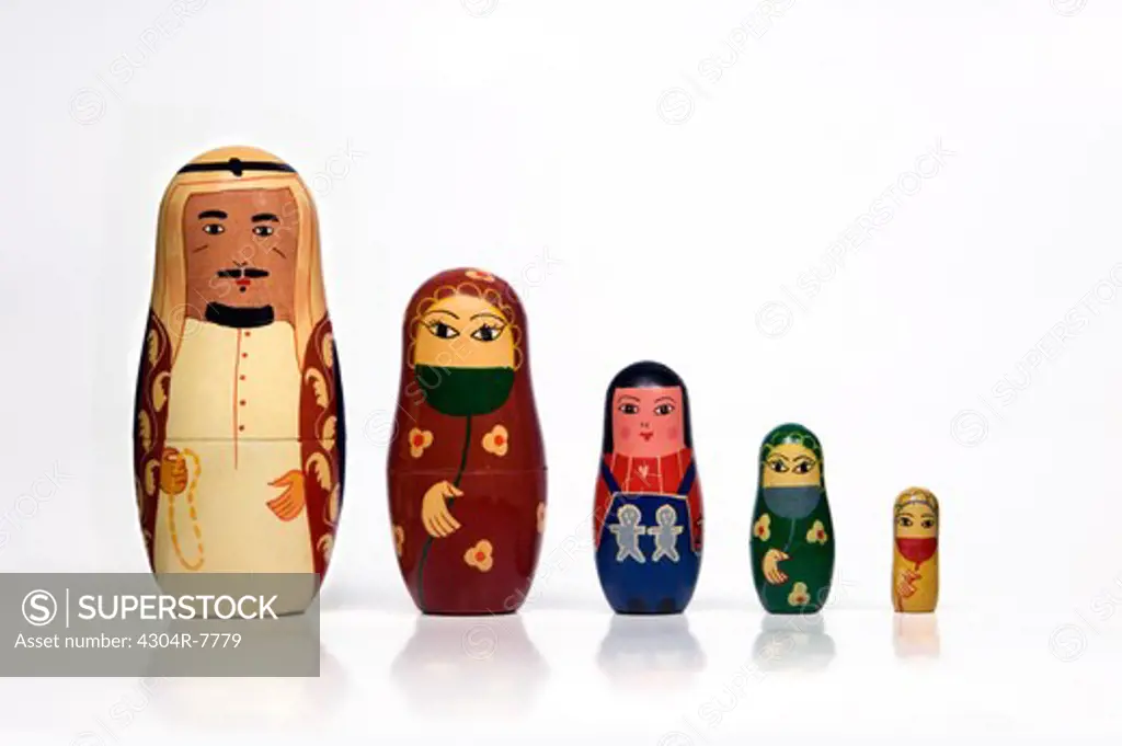 Set of Arabian matryoshka dolls arranged in a row by order of size