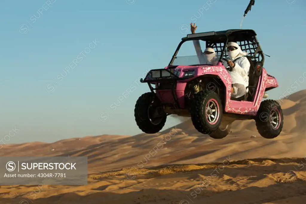 Dune buggy riders seen in the desert of Liwa, Abu Dhabi - UAE