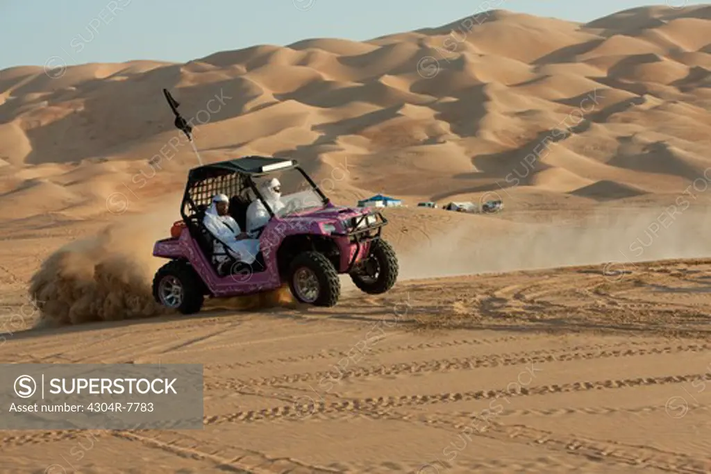 Dune buggy riders seen in the desert of Liwa, Abu Dhabi - UAE