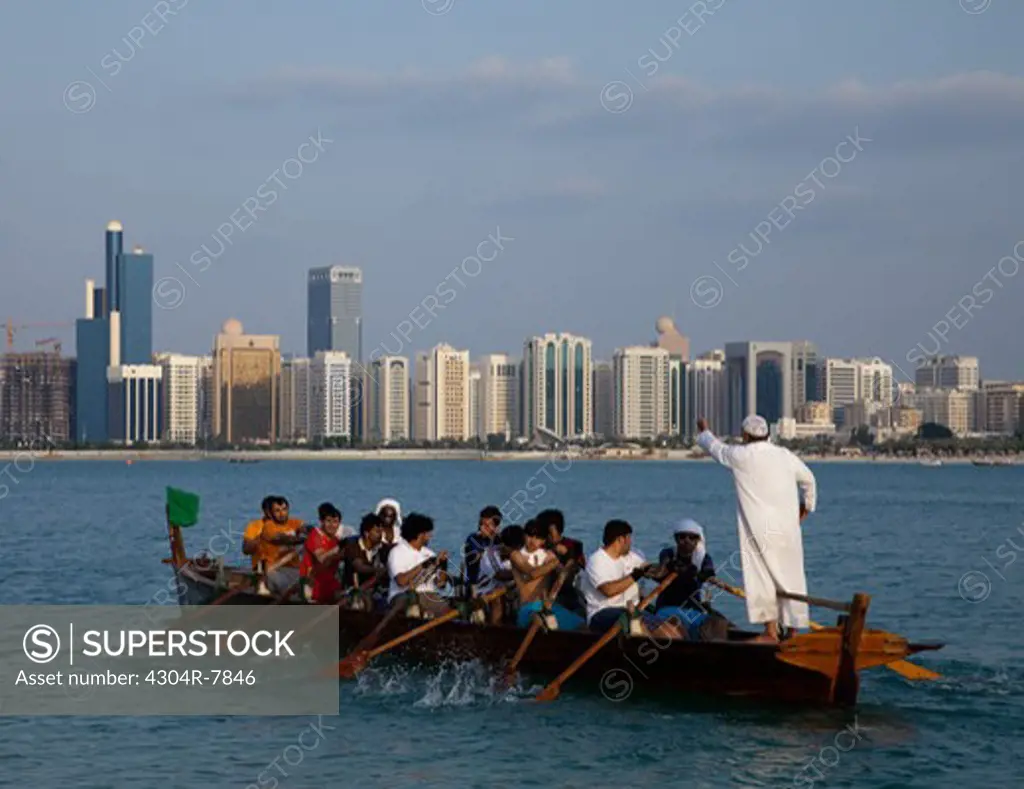 Traditional Rowing Dhow with Abu Dhabi sky in background, UAE