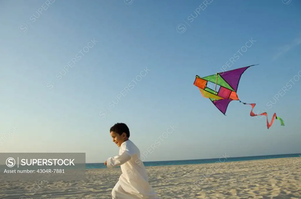 Young boy flying the kite