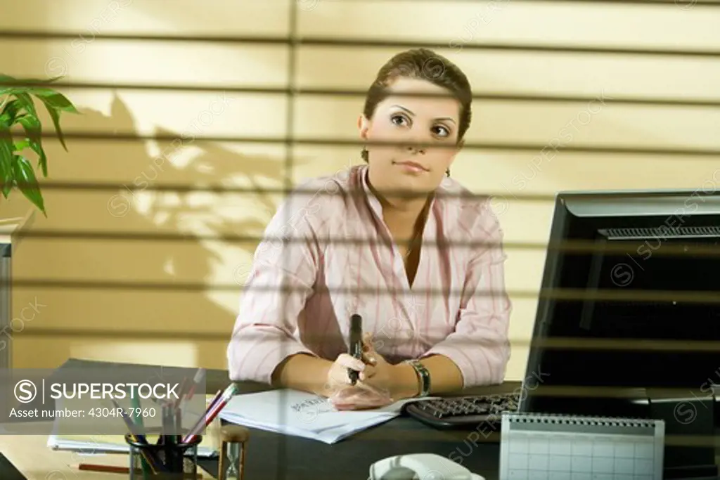 Woman dreaming in office