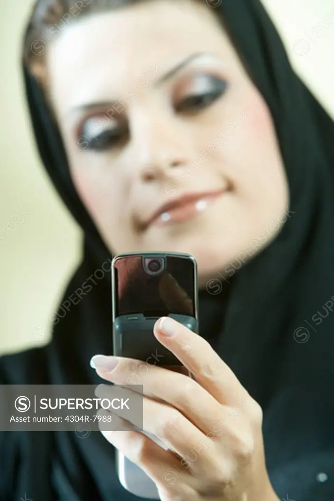 Arab businesswoman talking on phone in the office