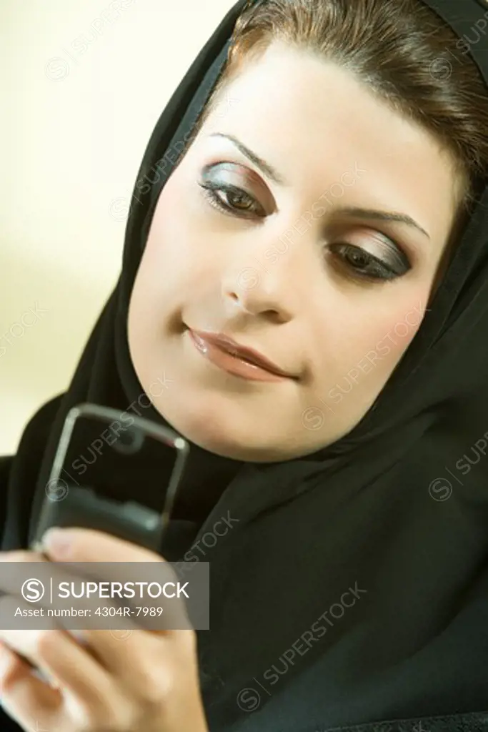 Arab businesswoman talking on phone in the office